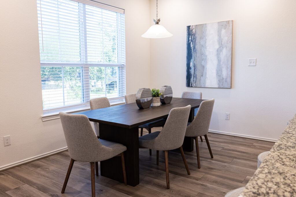 modern dark wood kitchen table with grey chairs