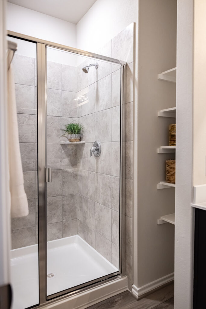 modern bathroom with full size shower and white tiles