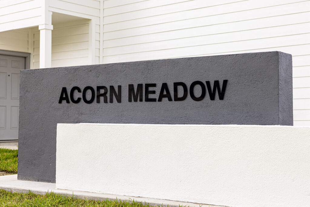 Acorn Meadow sign in front of neigh borhood