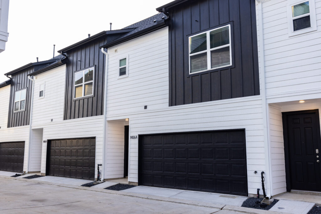 garages that are grey and attached to townhomes