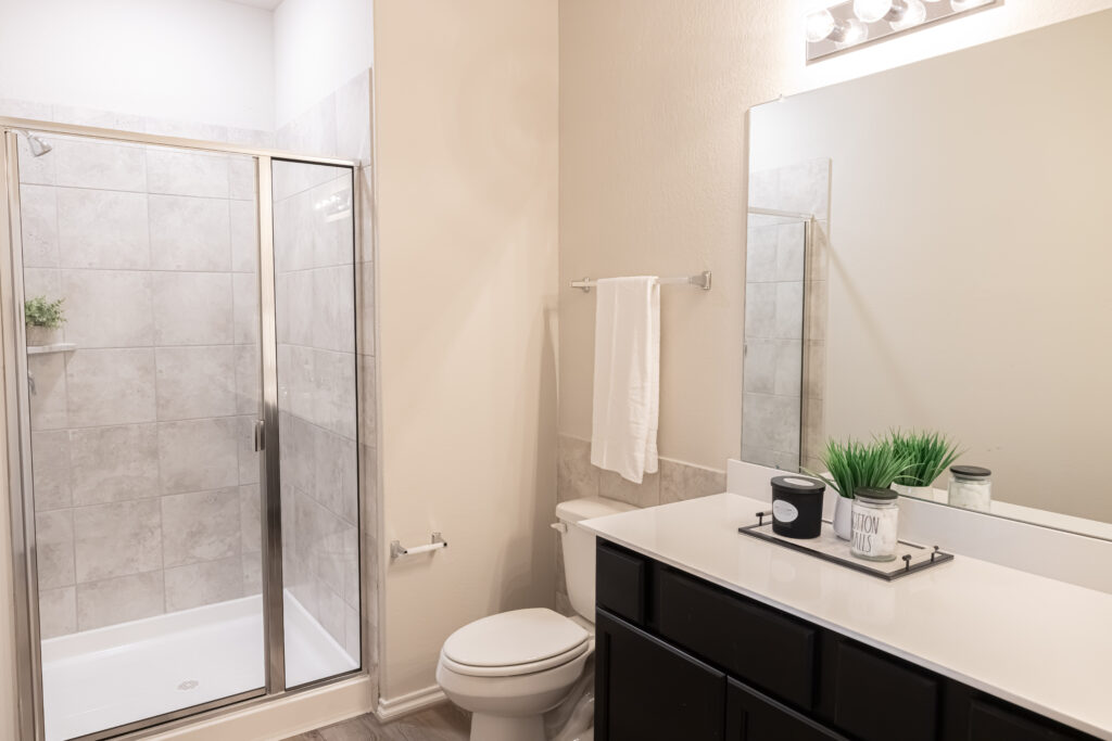 bathroom with white counter and wall features