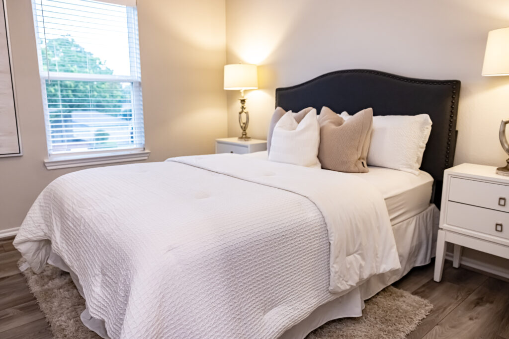 bedding in a new bedroom with white blankets and pillows