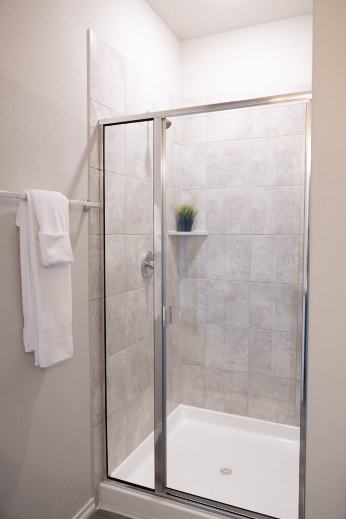 spacial shower with grey tiles