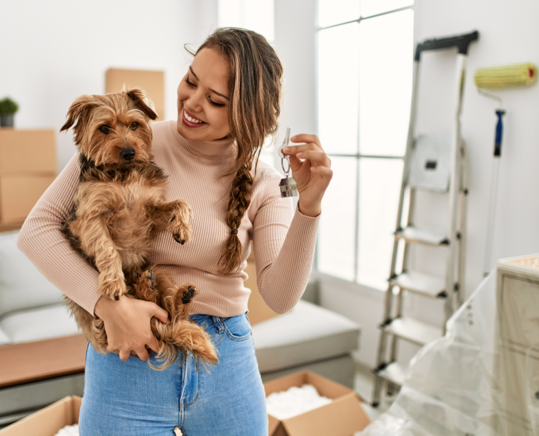 Woman enjoying her new rental home with her pet