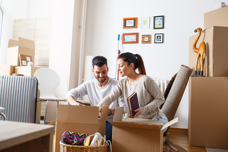 Couple opening boxes in their new rental home