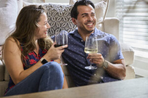 A couple drinking wine in a HomeSite home