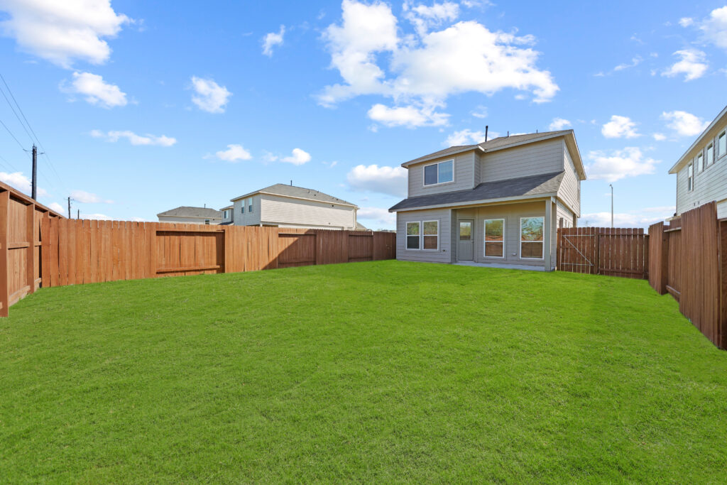 sunny fenced in backyard